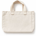 A plain Svante organic cotton canvas tote bag in a light cream or off-white colour, featuring two top handles and a structured rectangular shape, shown against a plain white background.