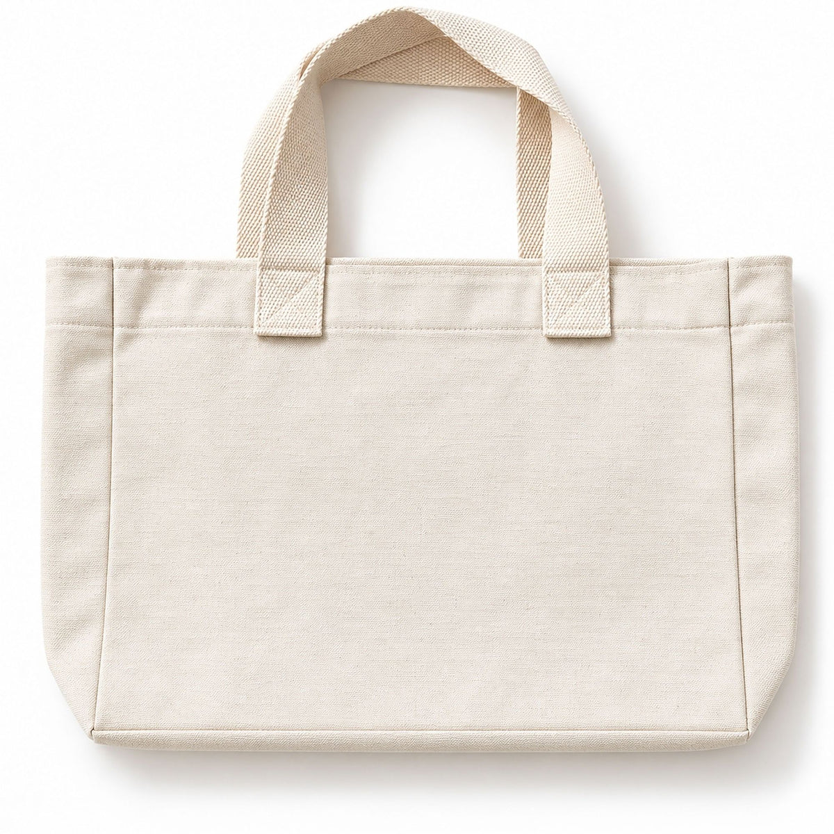 A plain Svante organic cotton canvas tote bag in a light cream or off-white colour, featuring two top handles and a structured rectangular shape, shown against a plain white background.