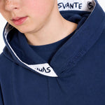 Close-up of a boy wearing a Svante regenerative cotton navy blue hoodie with a contrasting white inner hood lining featuring the brand name 'SVANTE' in black.