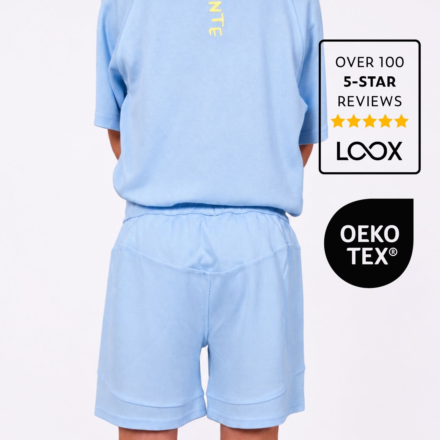 Boys Light blue sports outfit with visible brand logos and five star reviews on a white background