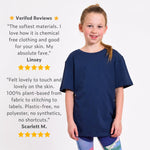 Girl wearing a navy blue regenerative cotton t shirt with text about chemical-free, plant-based clothing. 