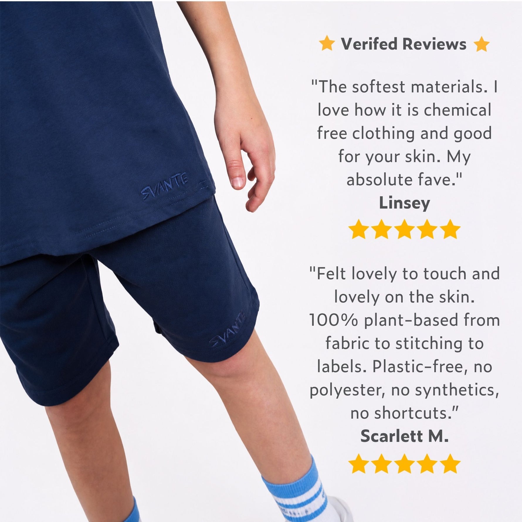 Boy wearing regenerative cotton navy blue shorts with positive reviews displayed on a white background. 