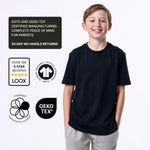 Boy wearing an organic cotton navy blue T-shirt with certification logos on a white background. 