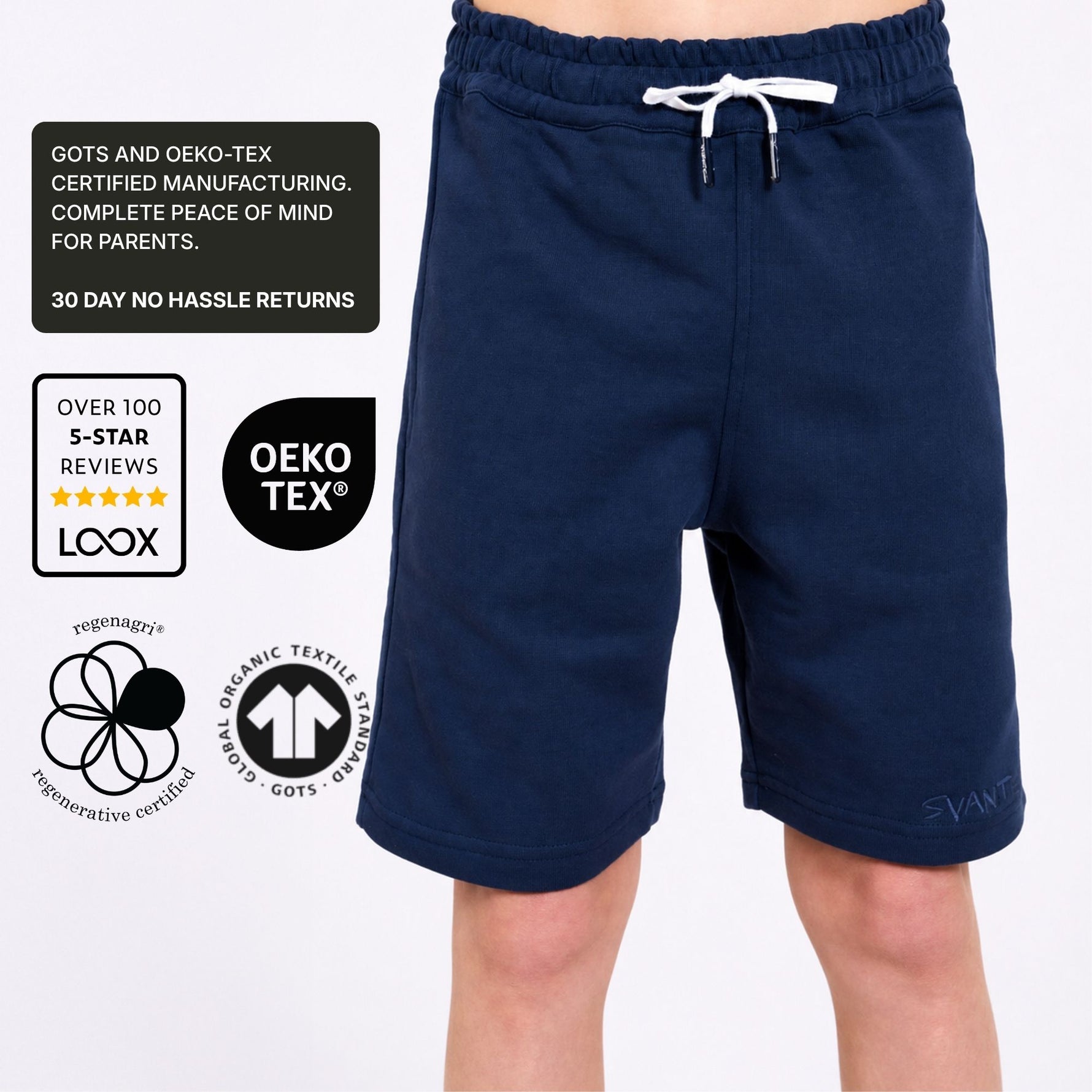 Organic cotton navy blue jersey shorts with drawstring on a white background, featuring certification logos. 