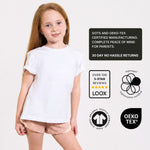 Young girl wearing a white organic cotton t-shirt with certification logos on a light grey background. 